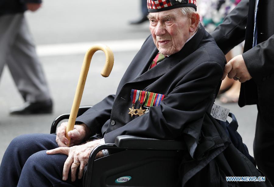 A veteran is seen in a parade from Horse Guards Parade to Westminster Abbey after a service of commemoration during the 70th Anniversary commemorations of VJ Day (Victory over Japan) in London, Britain, on Aug. 15, 2015. (Xinhua/Han Yan) 