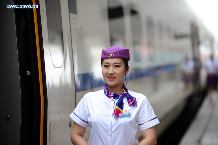 The high-speed train D7989 prepares to depart for Qiqihar at the Harbin Railway Station in Harbin, capital of northeast China's Heilongjiang Province, Aug. 17, 2015. 