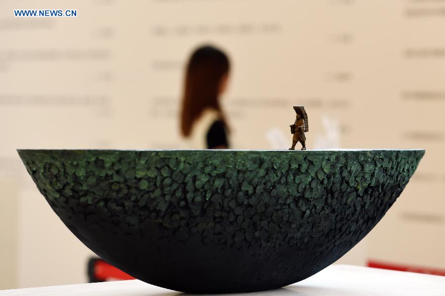 Photo taken on Aug. 17, 2015 shows a sculpture during an exhibition at Gansu Theater in Lanzhou, capital of northwest China's Gansu Province. 