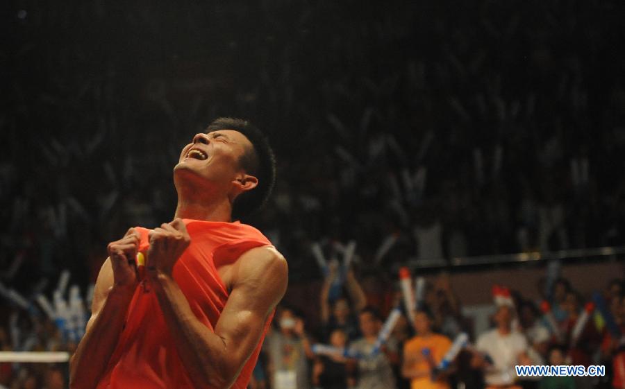 Chen Long of China reacts after winning the men's singles final match against Lee Chong Wei of Malaysia at the BWF World Championships 2015 in Jakarta, Indonesia, Aug. 16, 2015.