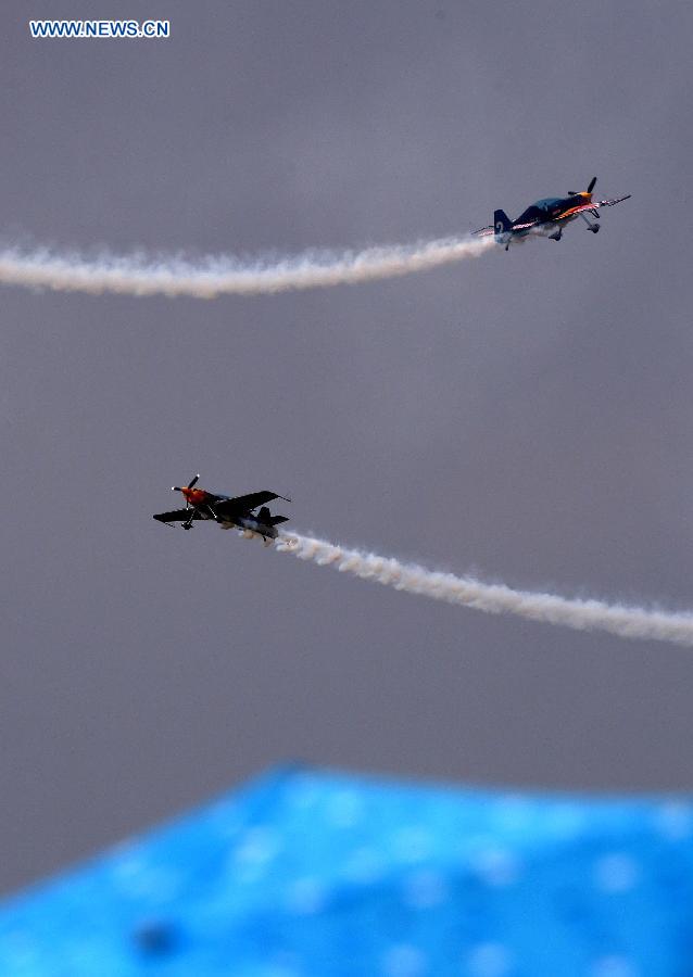 Two aircraft show aerobatics at the opening ceremony of the 2015 Shenyang Faku International Flight Convention, in Faku County of Shenyang, capital of northeast China's Liaoning Province, Aug. 20, 2015.