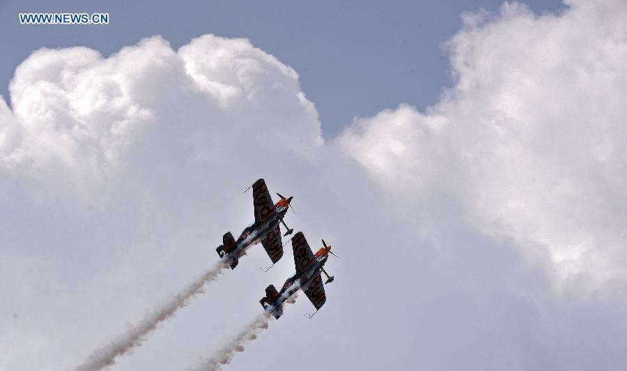 Two aircraft show aerobatics at the opening ceremony of the 2015 Shenyang Faku International Flight Convention, in Faku County of Shenyang, capital of northeast China's Liaoning Province, Aug. 20, 2015.