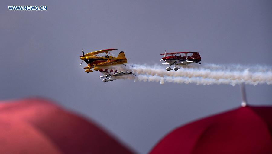 Two Australian pilots stage an stunt performance at the opening ceremony of the 2015 Shenyang Faku International Flight Convention, in Faku County of Shenyang, capital of northeast China's Liaoning Province, Aug. 20, 2015. 