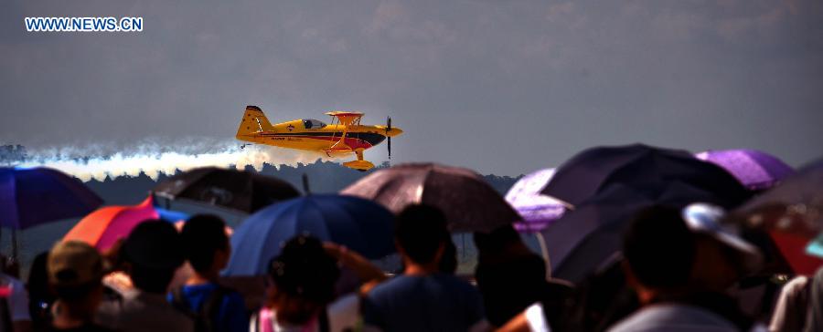 An aircraft performs a low altitude flight at the 2015 Shenyang Faku International Flight Convention, in Faku County of Shenyang, capital of northeast China's Liaoning Province, Aug. 21, 2015. 