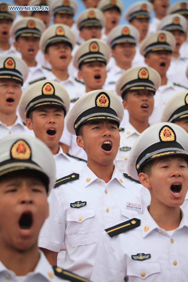 Photo taken on July 23, 2015 shows soldiers of the chorus participating in training for the Sept. 3 military parade at the parade training base in Beijing. 