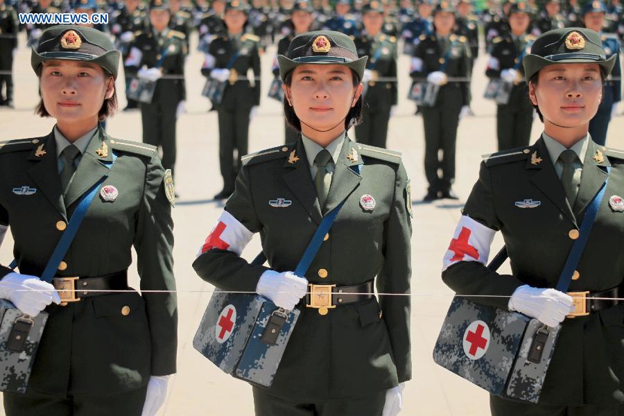 Photo taken on Aug. 4, 2015 shows soldiers participating in training for the Sept. 3 military parade at the parade training base in Beijing. 