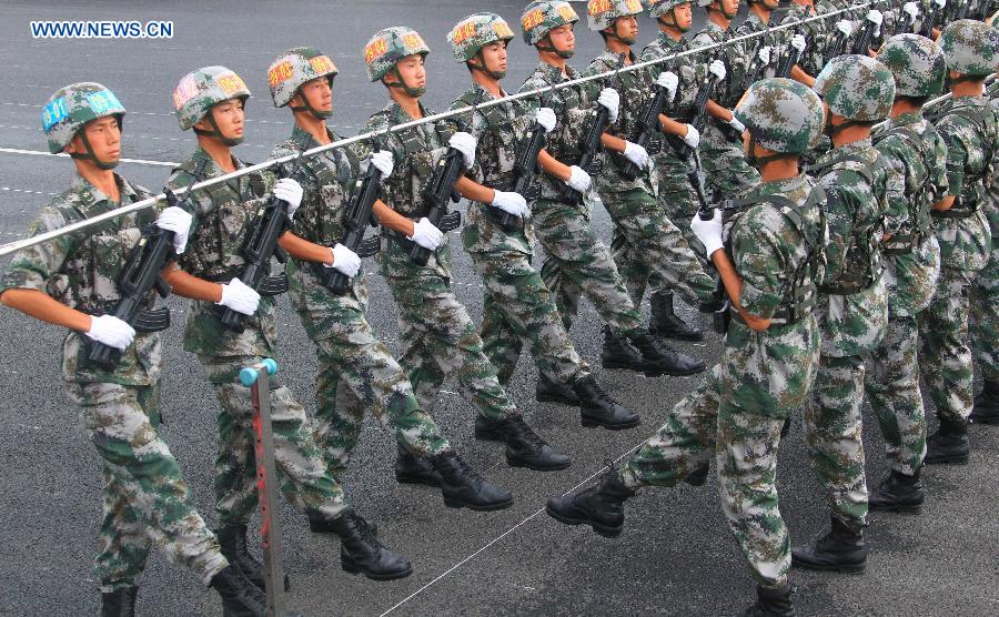 Photo taken on July 23, 2015 shows soldiers participating in training for the Sept. 3 military parade at the parade training base in Beijing. 