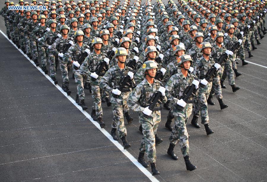 Photo taken on July 29, 2015 shows soldiers participating in training for the Sept. 3 military parade at the parade training base. 