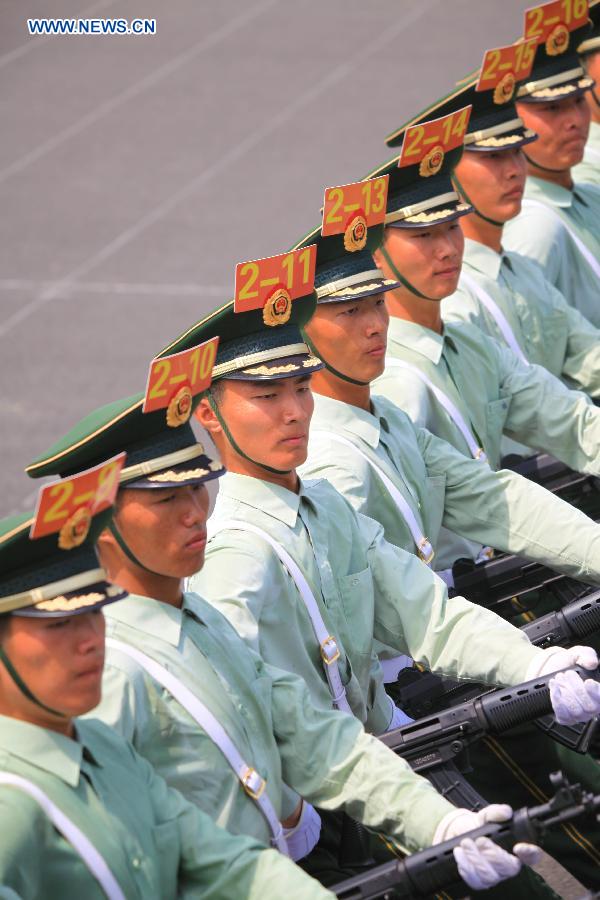 Photo taken on July 24, 2015 shows soldiers participating in training for the Sept. 3 military parade at the parade training base.