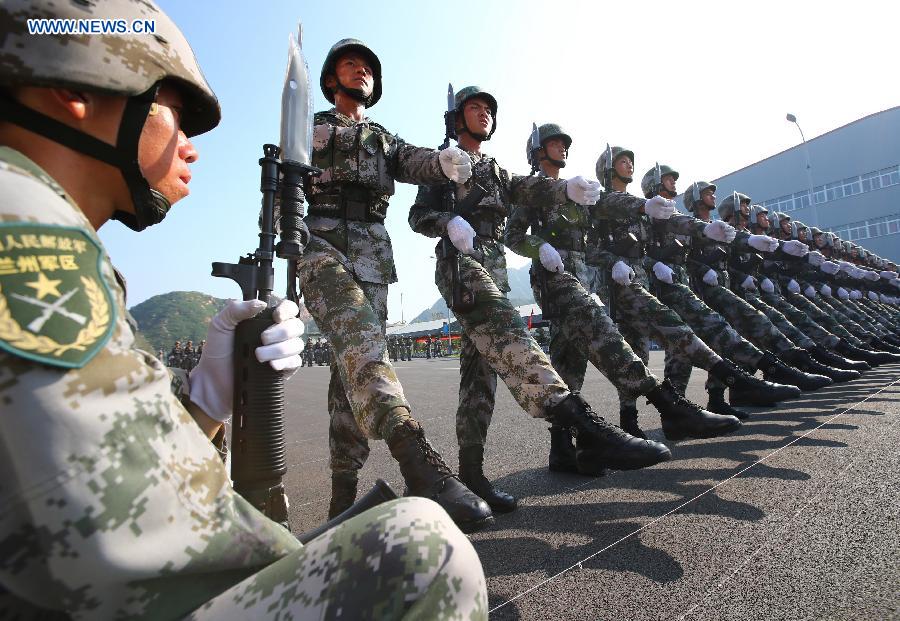 Photo taken on July 28, 2015 shows soldiers participating in training for the Sept. 3 military parade at the parade training base. 