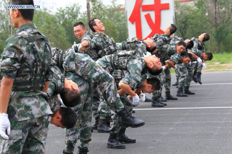 Photo taken on July 23, 2015 shows soldiers participating in training for the Sept. 3 military parade at the parade training base.