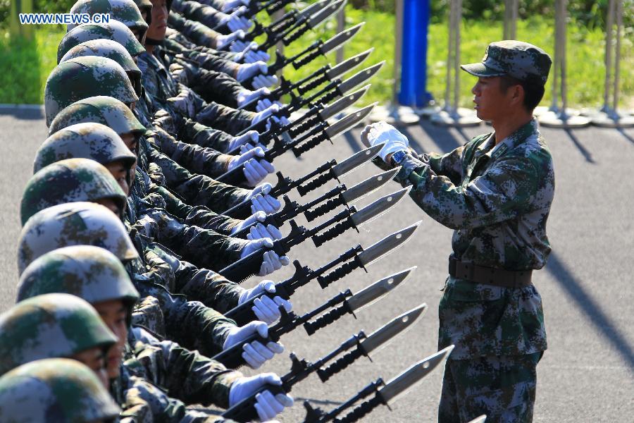 Photo taken on July 28, 2015 shows soldiers participating in training for the Sept. 3 military parade at the parade training base. 