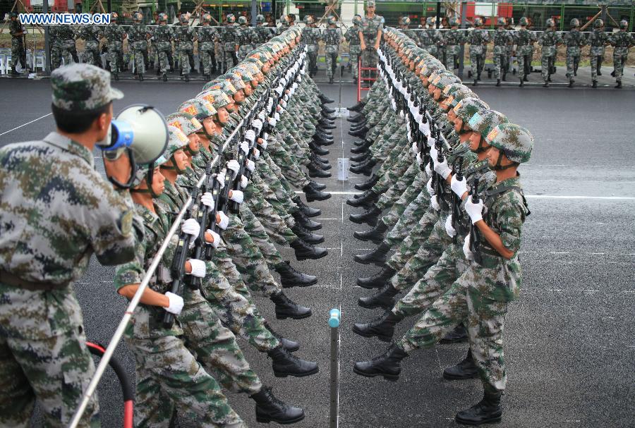 Photo taken on July 23, 2015 shows soldiers participating in training for the Sept. 3 military parade at the parade training base in Beijing. 