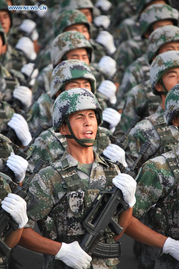 Photo taken on July 23, 2015 shows soldiers participating in training for the Sept. 3 military parade at the parade training base in Beijing. 