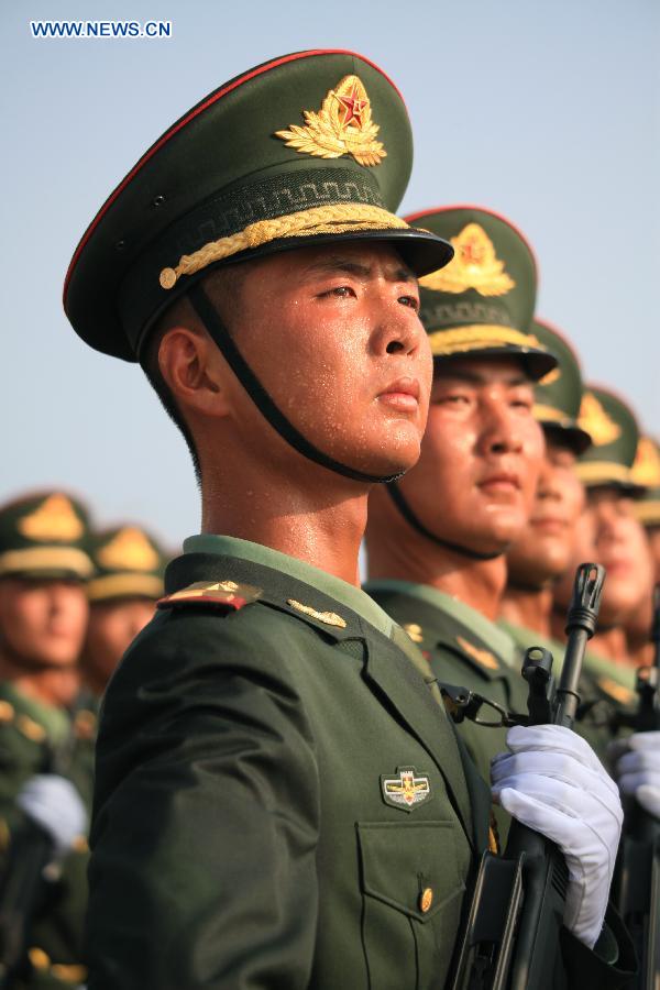 Photo taken on July 28, 2015 shows soldiers participating in training for the Sept. 3 military parade at the parade training base.