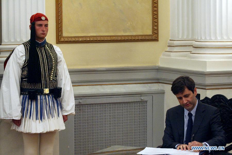 Greece's newly appointed caretaker Prime Minister Vassiliki Thanou (front) attends the new government's swearing-in ceremony at the Presidential Palace in Athens, capital of Greece, on Aug. 28, 2015.