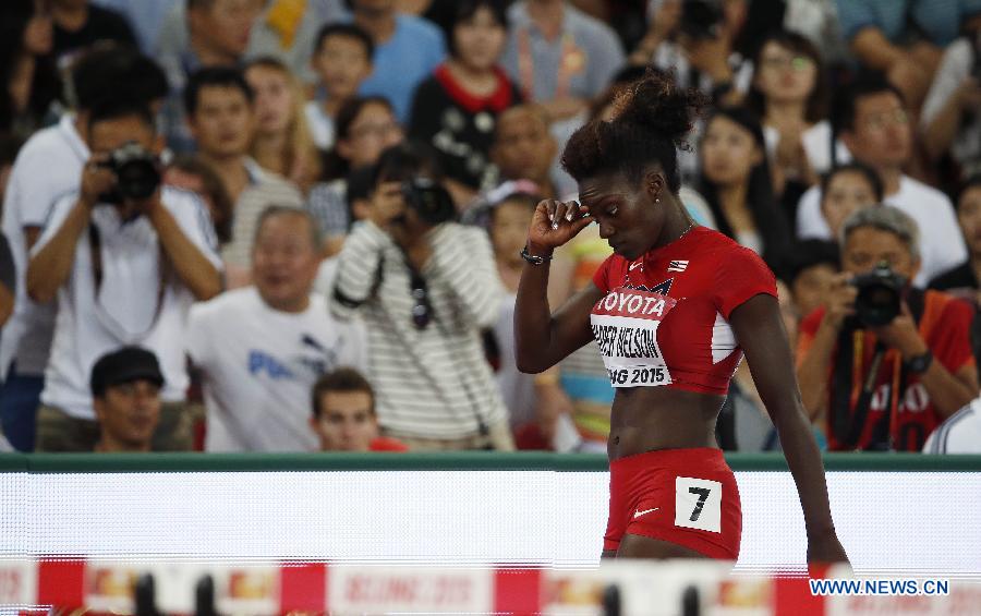 Austria's Beate Schrott falls during the women's 100m hurdles semifinal at the 2015 IAAF World Championships at the 'Bird's Nest' National Stadium in Beijing, capital of China, Aug. 28, 2015. 