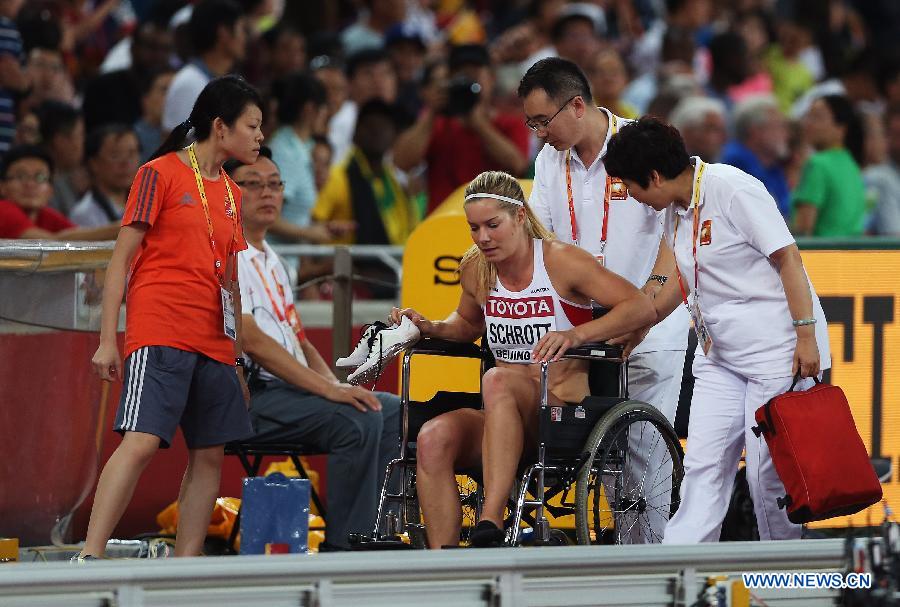 Austria's Beate Schrott falls during the women's 100m hurdles semifinal at the 2015 IAAF World Championships at the 'Bird's Nest' National Stadium in Beijing, capital of China, Aug. 28, 2015. 