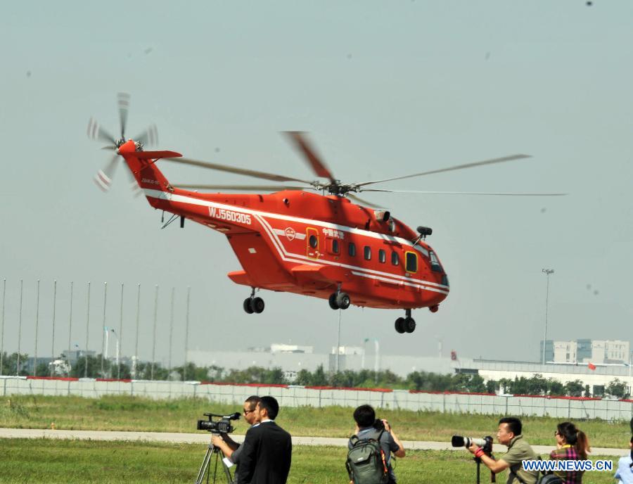 A helicopter practises for the coming China Helicopter Exposition in a helicopter base of Aviation Industry Corporation of China in the Airport Area of China Pilot Free Trade Zone of Tianjin, north China, Sept. 7, 2015. 