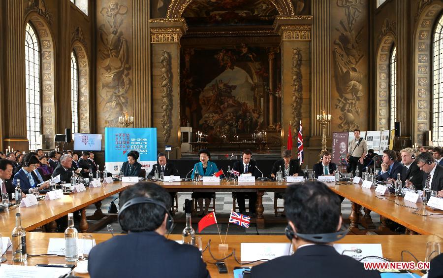 Chinese Vice Premier Liu Yandong (L Center) and British Health Secretary Jeremy Hunt (R Center) co-chair the third meeting of the China-Britain high-level cultural exchange mechanism in London, Britain, on Sept. 17, 2015. 