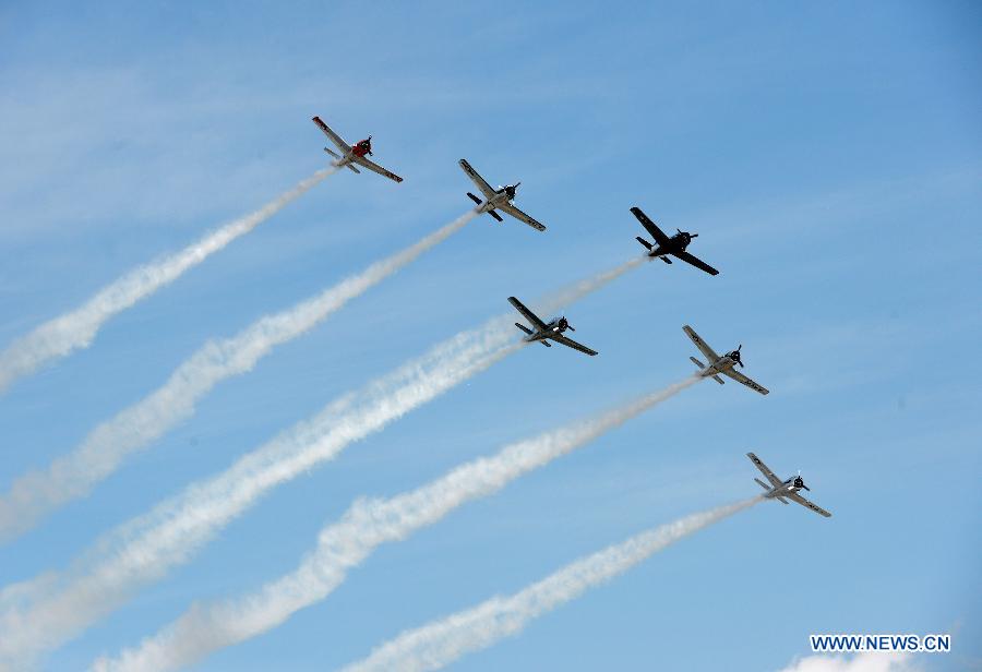 Planes perform aerobatic show during an air show at Andrews Air Base outside Washington D.C. in Maryland, the United States, Sept. 19, 2015.