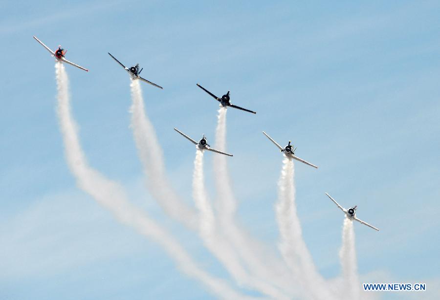 Planes perform aerobatic show during an air show at Andrews Air Base outside Washington D.C.in Maryland, the United States, Sept. 19, 2015. 