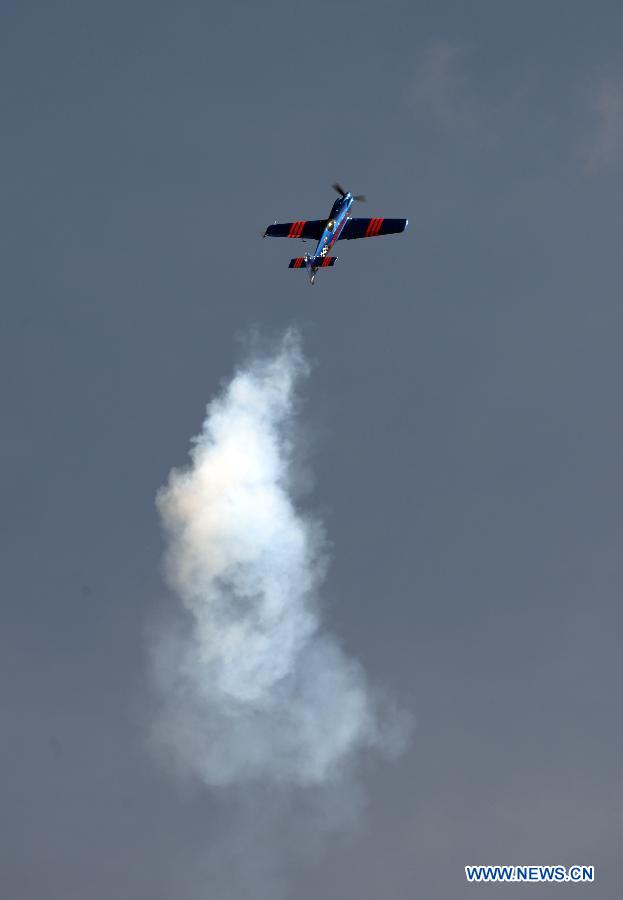 A plane performs during an air show at Andrews Air Base outside Washington D.C. in Maryland, the United States, Sept. 19, 2015.