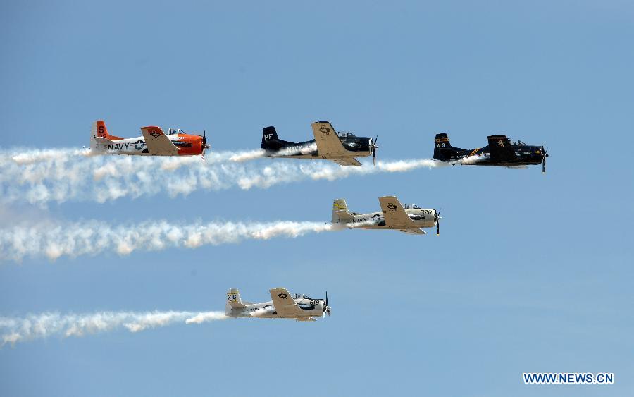 Planes perform aerobatic show during an air show at Andrews Air Base outside Washington D.C. in Maryland, the United States, Sept. 19, 2015. 