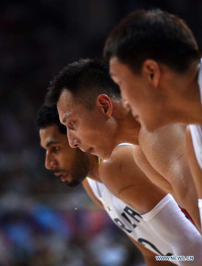 Yi Jianlian(C) of China reacts during the preliminary round Group C match against South Korea at 2015 FIBA Asia Championship in Changsha, capital of central China's Hunan Province, Sept. 24, 2015. 