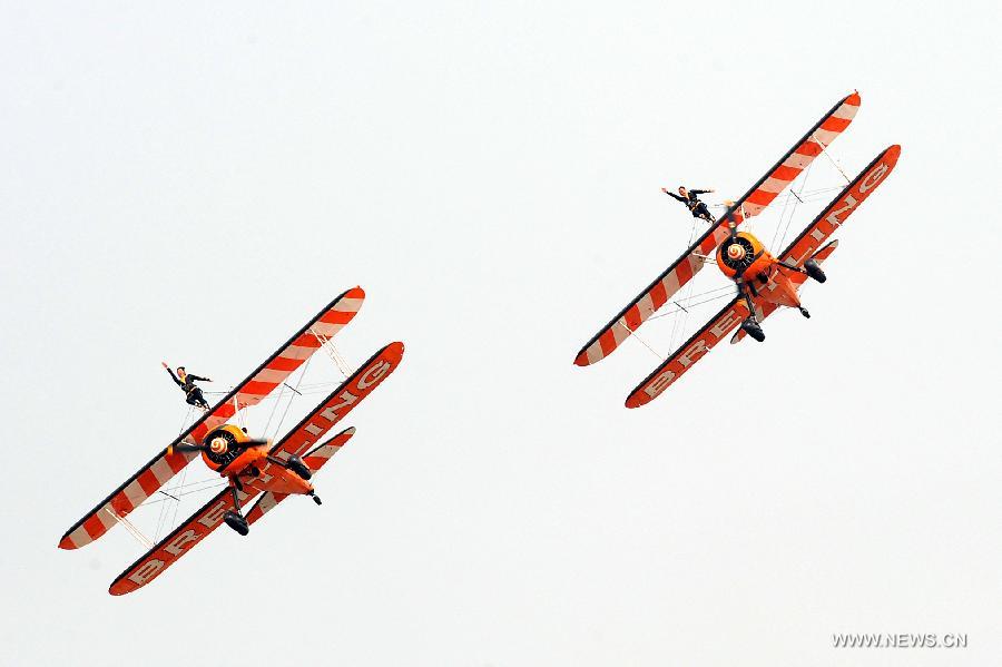 Breitling Jet Team perform aerobatics at Zhengzhou Airshow 2015 in Zhengzhou, capital of central China's Henan Province, Sept. 26, 2015. 