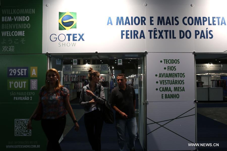 A model presents a creation of Brazilian students, made with textiles from exhibitors, during the GO TEX Show: Textile Products Trade International Fair, in Sao Paulo, Brazil, on Sept. 29, 2015. 