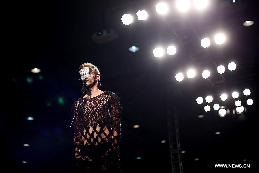 A model presents a creation of Brazilian students, made with textiles from exhibitors, during the GO TEX Show: Textile Products Trade International Fair, in Sao Paulo, Brazil, on Sept. 29, 2015. 