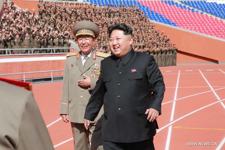 Photo provided by Korean Central News Agency (KCNA) on Oct. 14, 2015 shows top leader of the Democratic People's Republic of Korea (DPRK) Kim Jong Un recently having a photo session with the participants in the military parade celebrating the 70th anniversary of the ruling Workers' Party of Korea (WPK) in Pyongyang, capital of the Democratic People's Republic of Korea (DPRK).