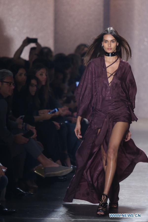 A Model presents a creation of the winter collection by Lilly Sarti during the Sao Paulo Fashion Week, in Sao Paulo, Brazil, on Oct. 19, 2015.