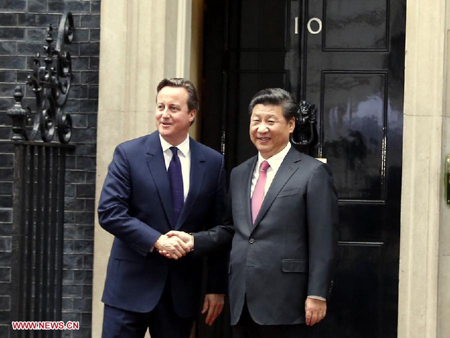 Chinese President Xi Jinping (R) holds talks with British Prime Minister David Cameron at 10 Downing Street in London, Britain, Oct. 21, 2015. 