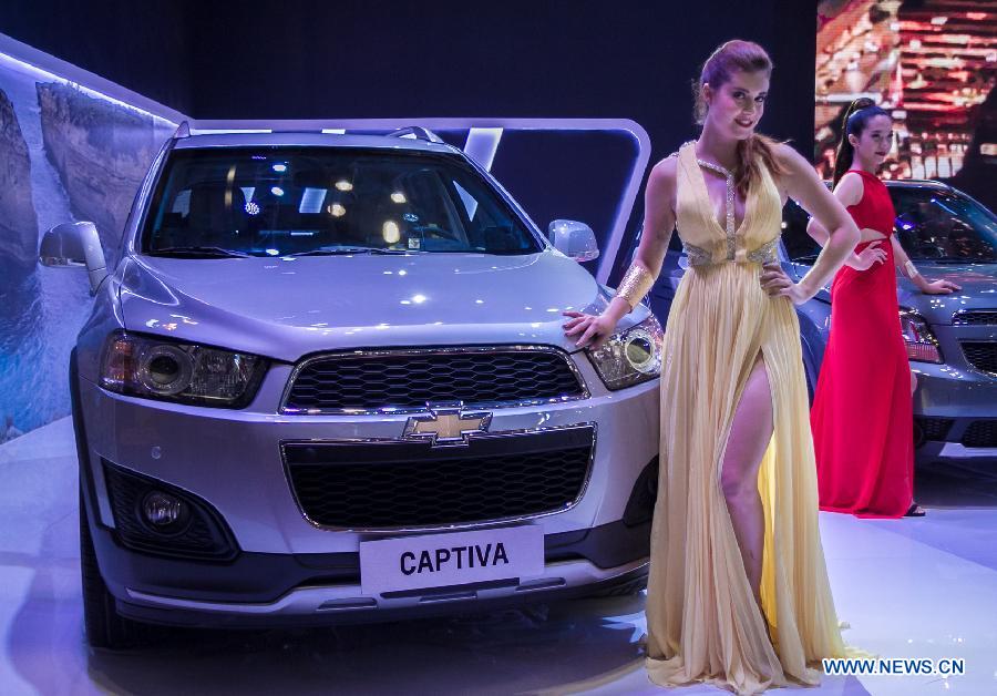 A model presents a car during the Vietnam Motor Show 2015 at Saigon Exhibition and Convention Centre in Ho Chi Minh city, Vietnam, Oct. 28, 2015.