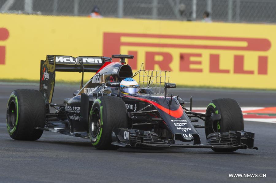 Spanish driver Fernando Alonso of McLaren team, takes part during the first practice session for the Formula One (F1) Mexican Grand Prix, at the Hermanos Rodriguez racetrack in Mexico City, capital of Mexico, Oct. 30, 2015. 