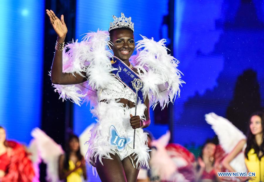 Awa Geremaya Sandrine Sanoko from Cote d'Ivoire waves after winning the championship of the 27th Miss Model of the World (MMW) Contest during the final in Shenzhen, south China's Guangdong Province, Oct. 31, 2015. 