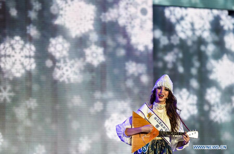 Nadezda Bychkova from Russia sings a song during the final of the 27th Miss Model of the World (MMW) Contest in Shenzhen, south China's Guangdong Province, Oct. 31, 2015. 