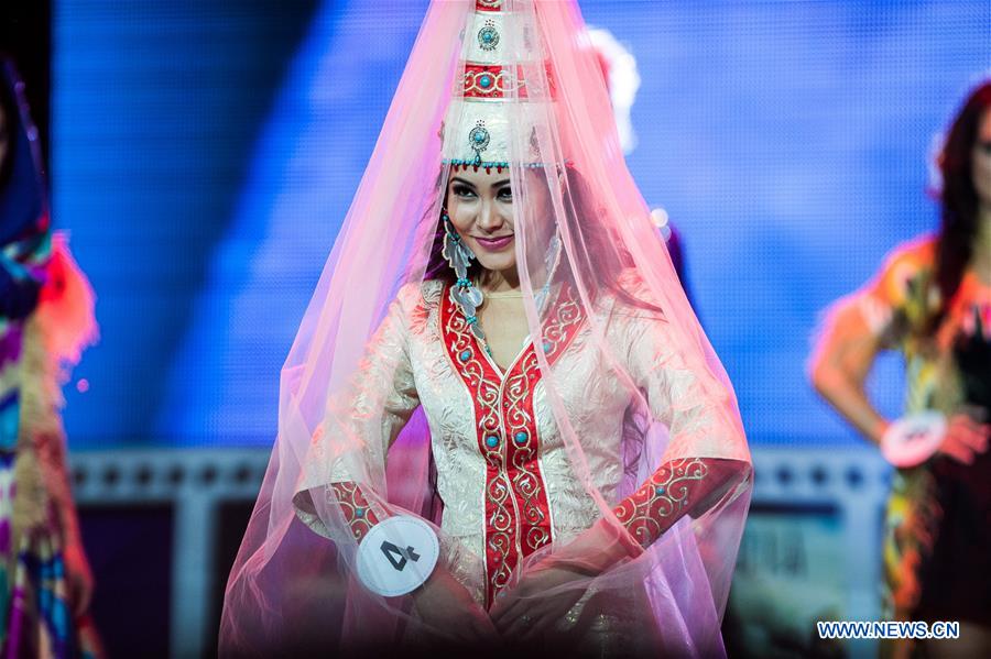 A competitor wearing ethnic costumes participates in the beauty pageant 'Krasa Rossii-2015' in Moscow, Russia, on Nov. 17, 2015. 