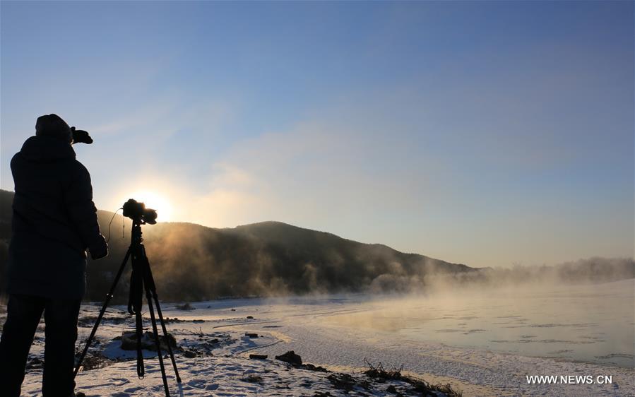 Photo taken on Nov. 21, 2015 shows the winter scenery near a river in Greater Khingan range in northeast China's Heilongjiang Province