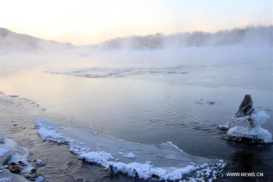 Photo taken on Nov. 21, 2015 shows the winter scenery near a river in Greater Khingan range in northeast China's Heilongjiang Province