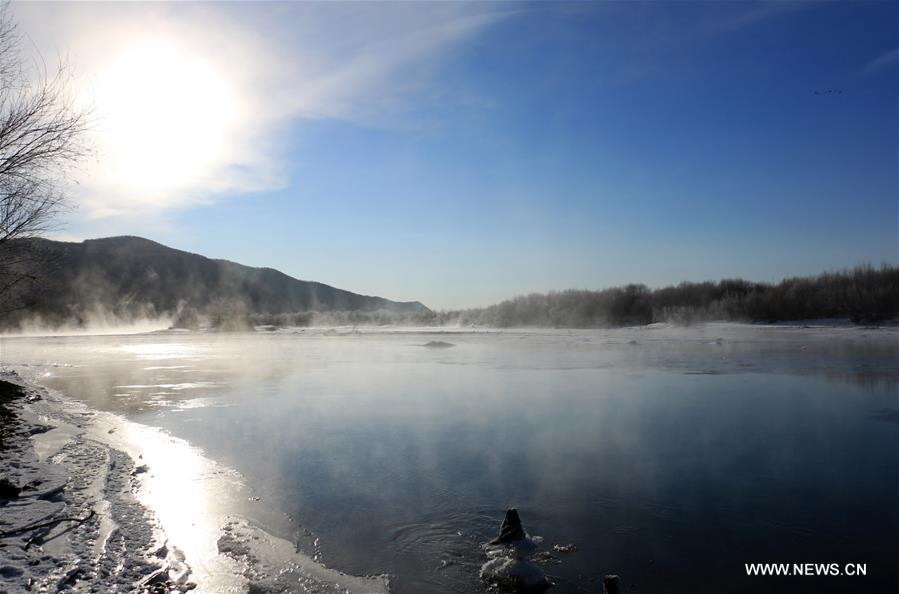 Photo taken on Nov. 21, 2015 shows the winter scenery near a river in Greater Khingan range in northeast China's Heilongjiang Province