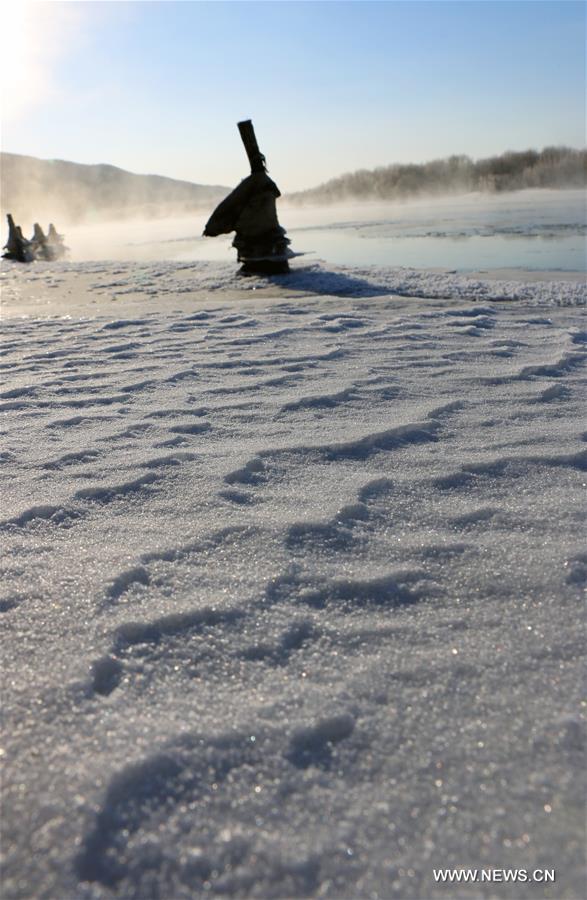 Photo taken on Nov. 21, 2015 shows the winter scenery near a river in Greater Khingan range in northeast China's Heilongjiang Province