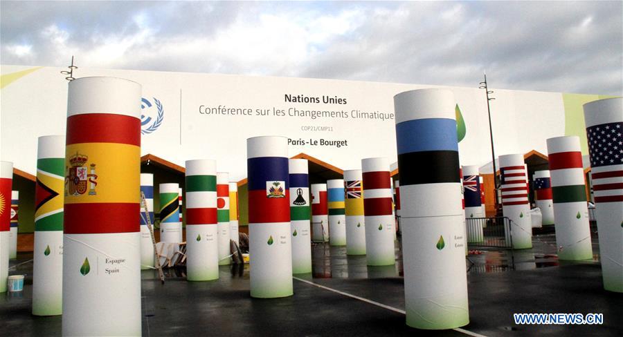 Workers work within the security lines at the entrance of Le Bourget where the 2015 United Nations Climate Change Conference (COP 21) will take place in Paris, France on Nov. 25, 2015. 