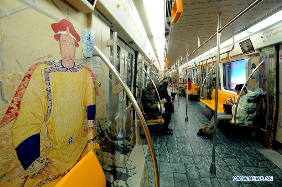 People take a train on subway line 2 in Shenyang, capital of northeast China's Liaoning Province, Dec. 2, 2015.