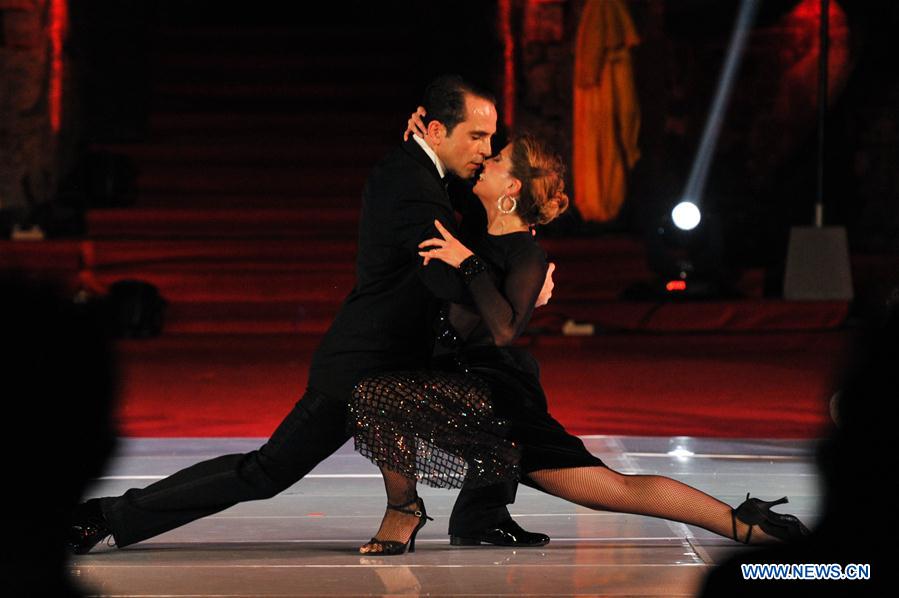 Tango dancers Ezequiel Paludi and Geraldine Rojas perform during the Tango in Paradise Festival at Denpasar in Bali, Indonesia, Nov. 28, 2015. Tango in Paradise Festival is an unique Tango festival that combines Tango with Indonesian traditional culture.  