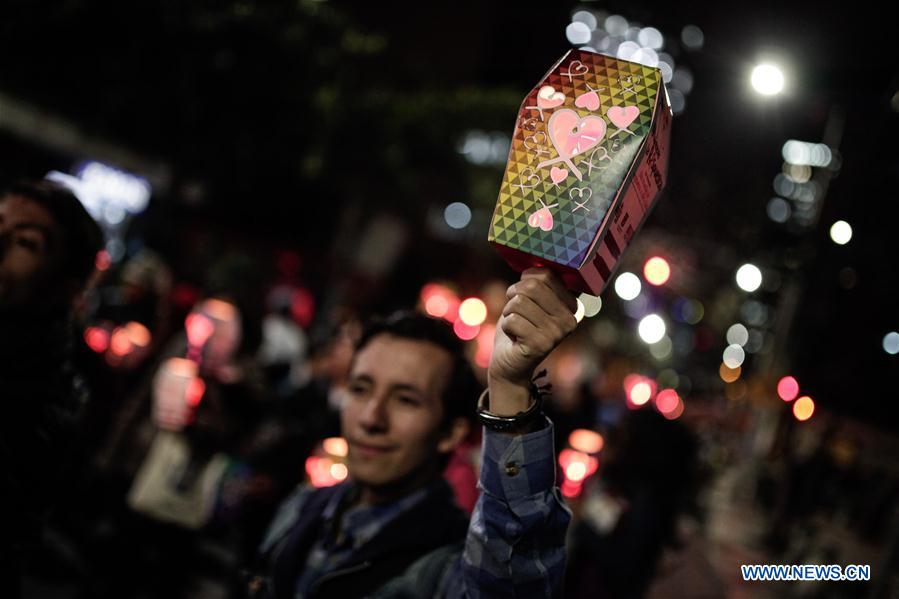 Residents take part in a march in commemoration of the World AIDS Day, in Bogota, Colombia, on Dec. 1, 2015. 