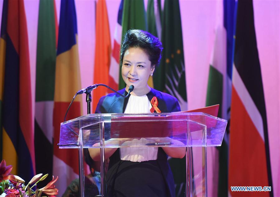 Peng Liyuan, wife of Chinese President Xi Jinping, attends an anti-AIDS advocacy activity in Johannesburg, South Africa, Dec. 5, 2015.