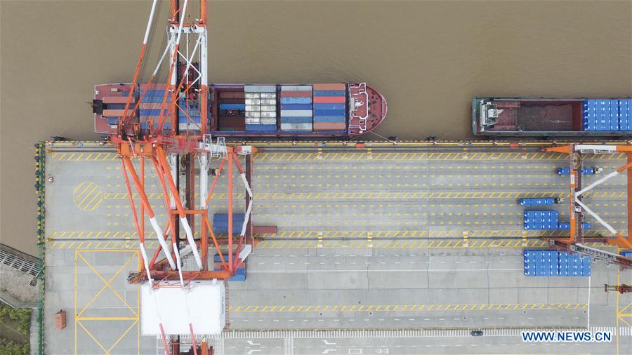 An aerial photo taken on Dec. 8, 2015 shows the Yangshan Port Container Terminal in Shanghai, east China. The throughput of the Yangshan Port Container Terminal has ranked top for consecutive five years in the world and it is designed to expand its throughput capacity to 40 million TEU (20-foot equivalent unit) by 2017. (Xinhua/Ding Ting) 